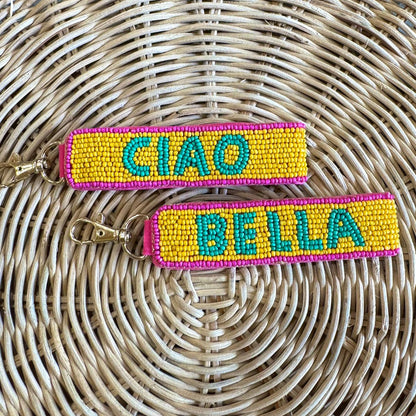 Two sided colorful keychains with 'CIAO' and 'BELLA' text on each beaded surface.